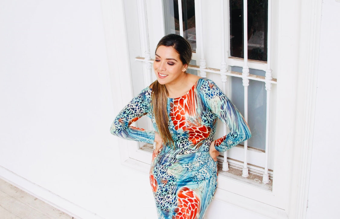 Eve open back animal print dress in teal in knee length