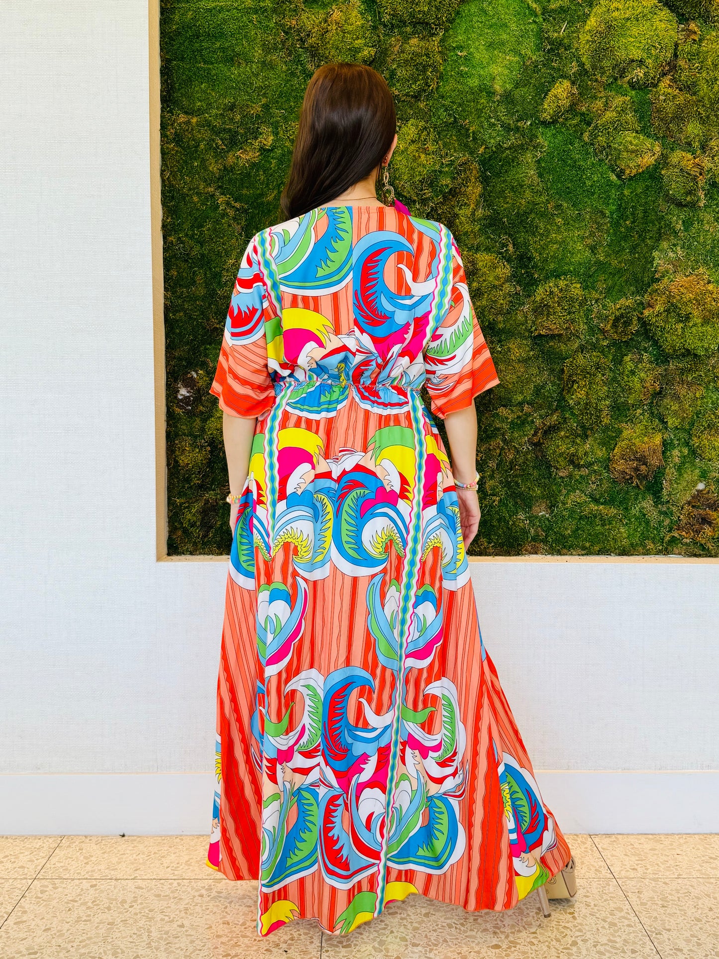 Raquel A line V neck maxi dress in an abstract orange print