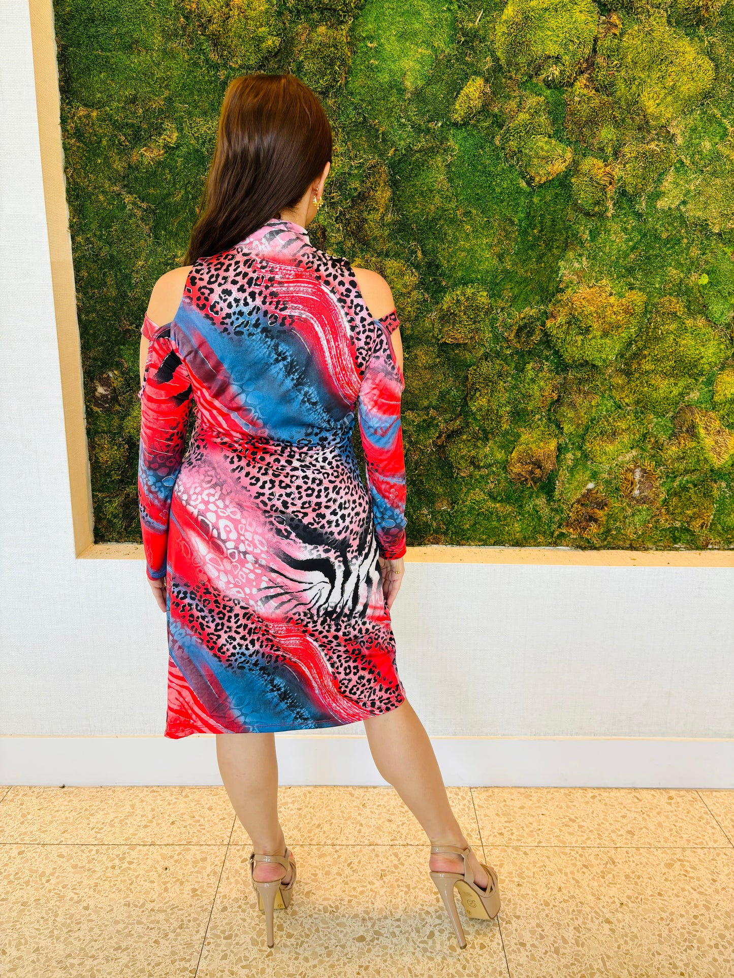 Hayden dress in red and blue animal print knee length with a peek a boo sleeve